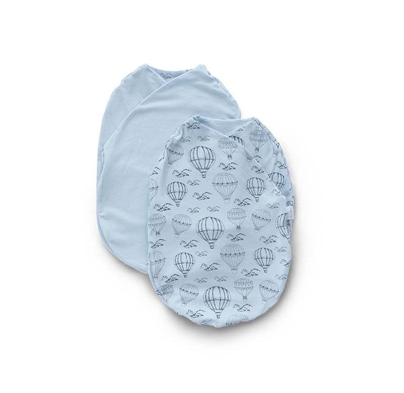 Reversible bon voyage design cocoon baby swaddle in bamboo cotton fabric.