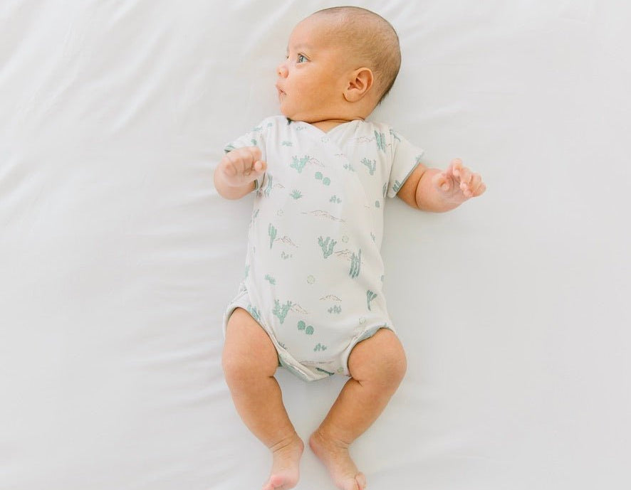 Reversible desert sunsets design cocoon baby swaddle in classic brushed fabric.