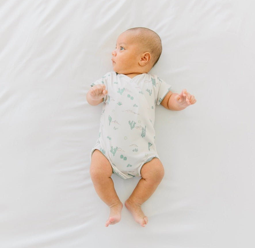 Reversible desert sunsets design cocoon baby swaddle in classic brushed fabric.