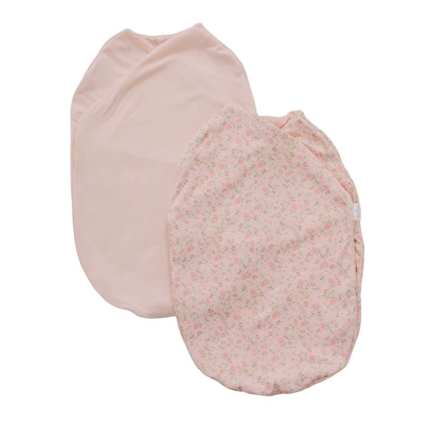 Reversible dusty roses design cocoon baby swaddle in classic brushed fabric.