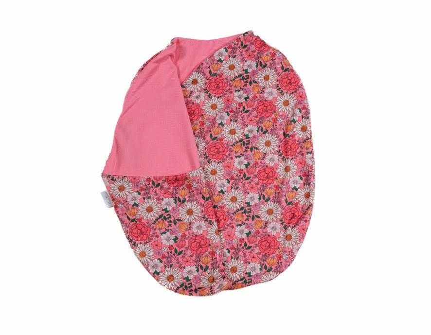 Reversible flower power design cocoon baby swaddle in classic brushed fabric.