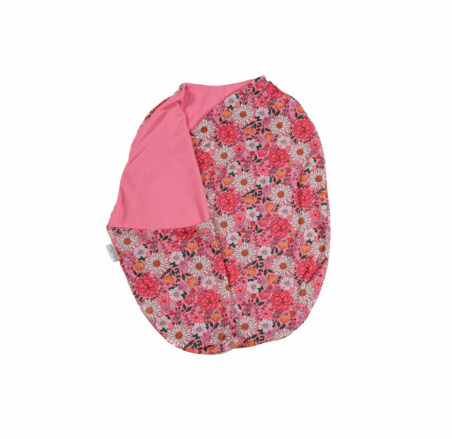 Reversible flower power design cocoon baby swaddle in classic brushed fabric.