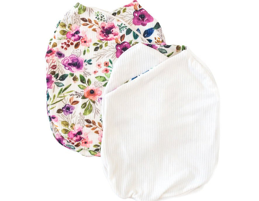 Reversible ivory wildflowers design cocoon baby swaddle in classic brushed fabric.
