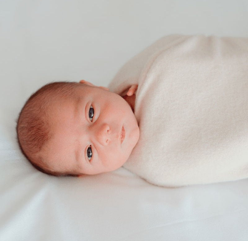 Reversible Baby Cocoon swaddle baby blanket in plush latte design in plush dream fabric styles.
