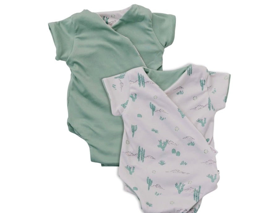 Reversible desert sunsets design short-sleeve baby onesie in classic brushed fabric.