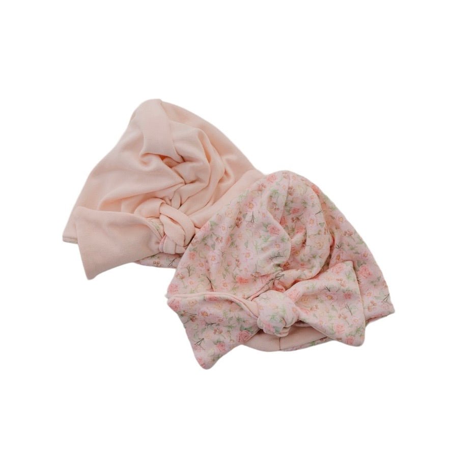 Reversible dusty roses design baby knotty beanie.
