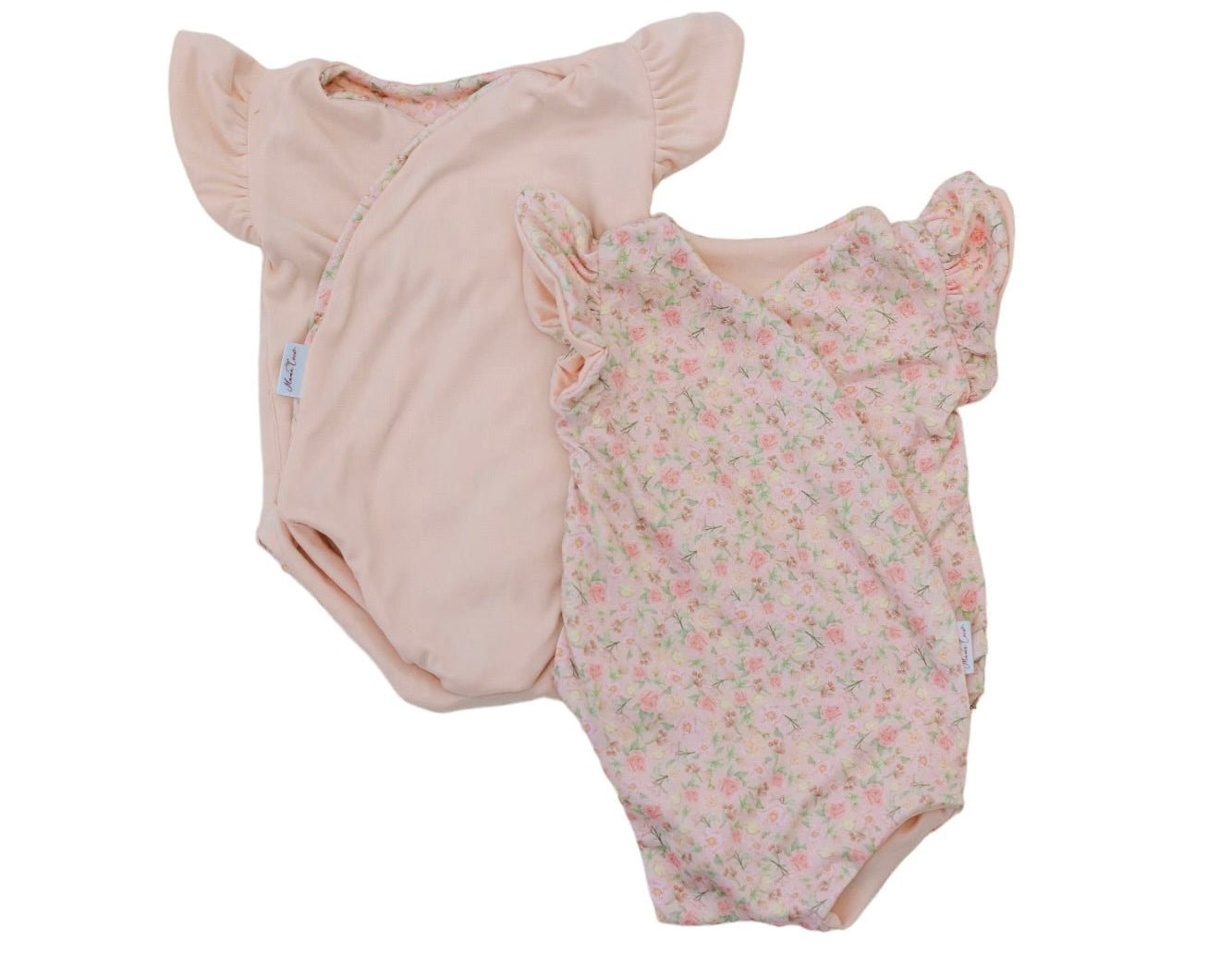Reversible dusty roses design flutter sleeve baby onesie in classic brushed fabric.