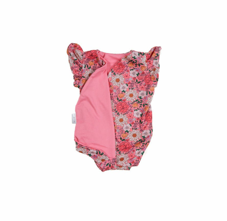 Reversible flower power design flutter sleeve baby onesie in classic brushed fabric.