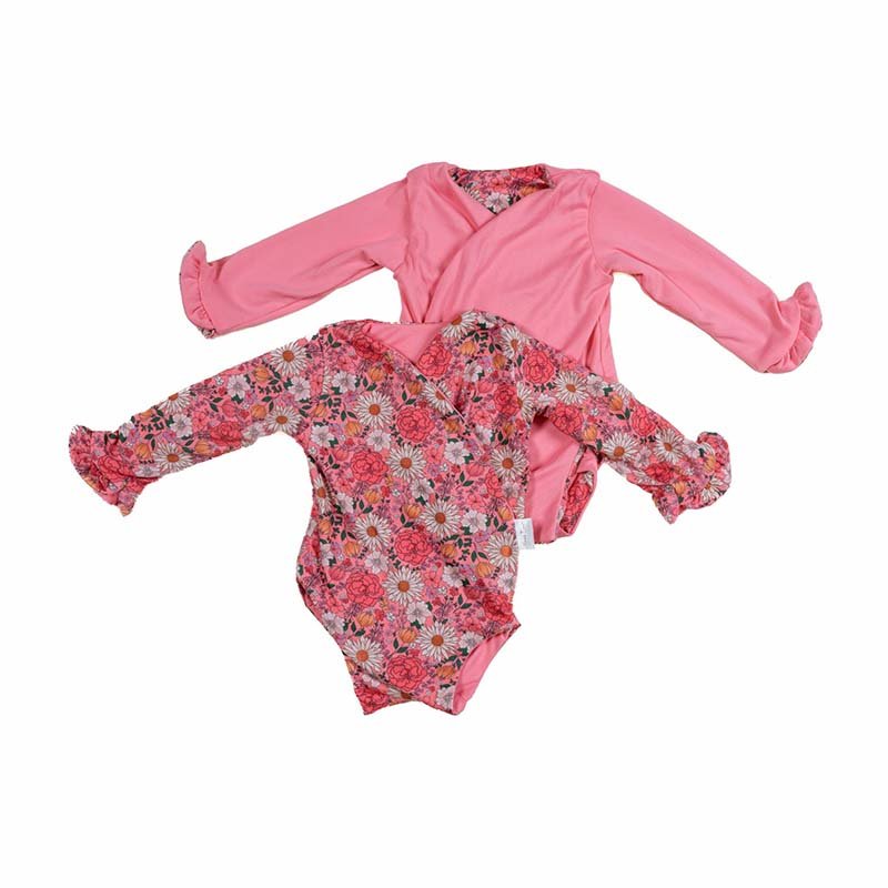 Reversible ruffle cuff baby bodysuit with wings in Flower Power design classic brushed fabric for babies.