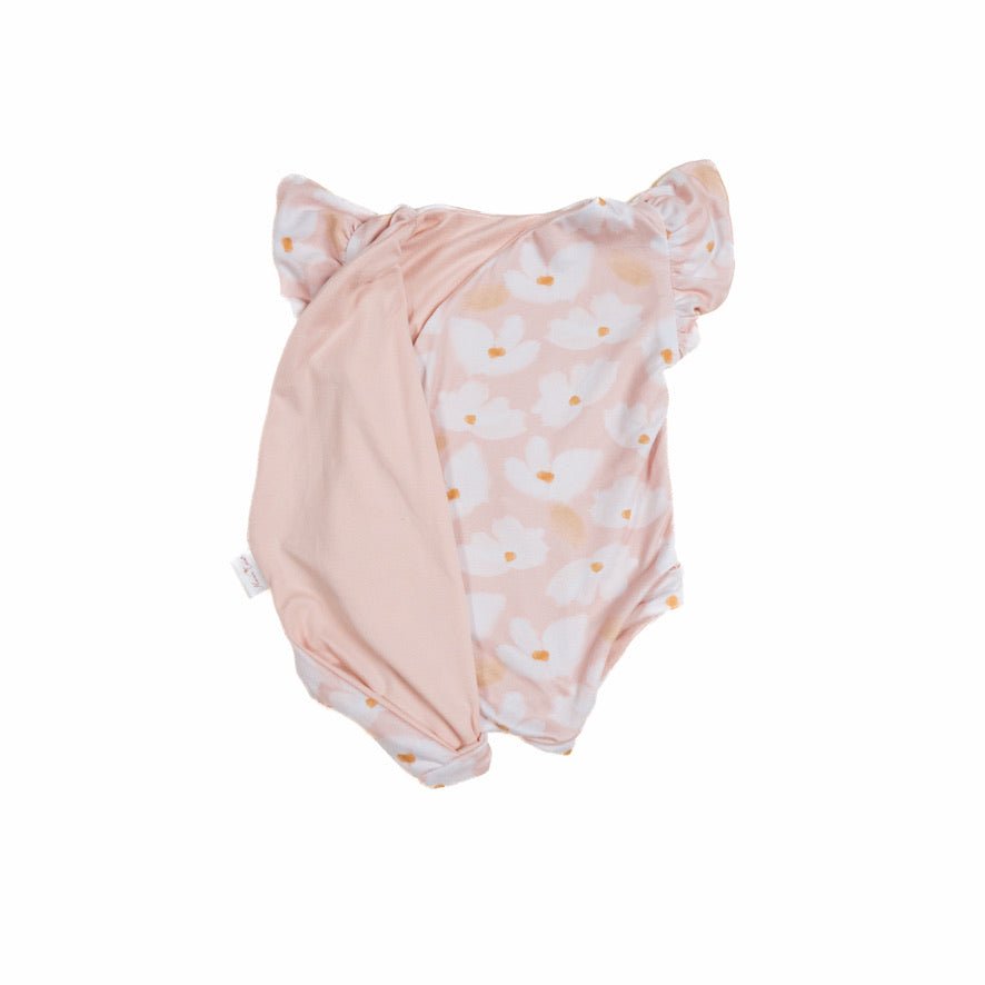 Reversible flutter sleeve baby onesie in sweet lily design.