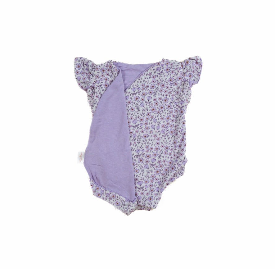 Reversible flutter sleeve baby onesie in purple posies design.