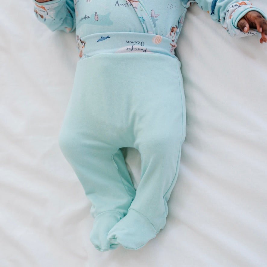 Reversible baby footie pants designed in bamboo cotton fabric featuring our World Traveler design.