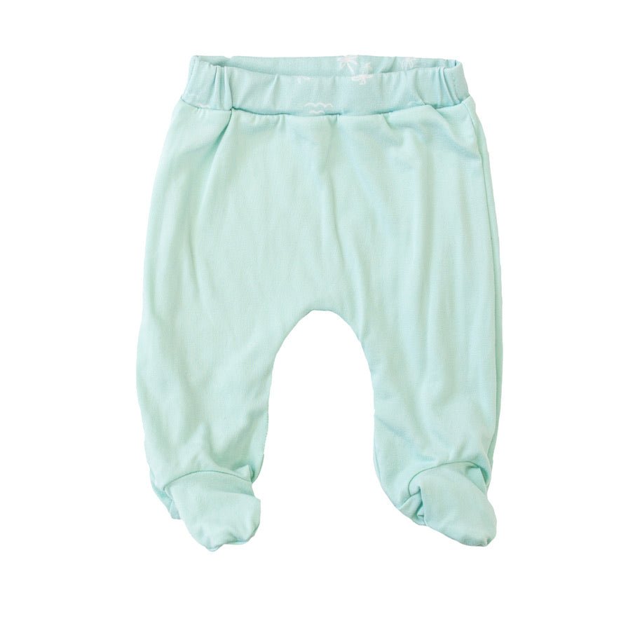 Reversible baby footie pants designed in ultra-soft bamboo cotton with the Honeydew Palms theme.