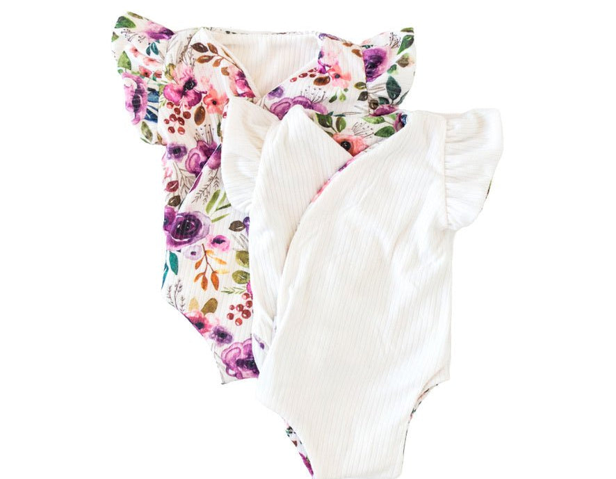 Reversible ivory wildflowers design flutter sleeve baby onesie in classic brushed fabric.