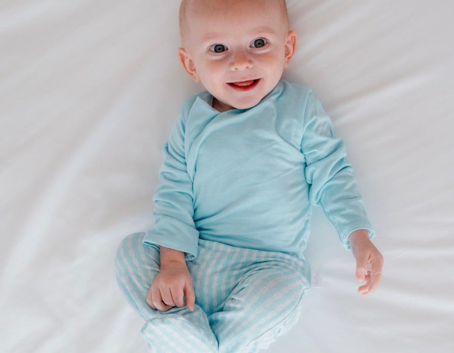 Cozy baby footie pants in silky modal fabric with an adorable Lil Surfer pattern.