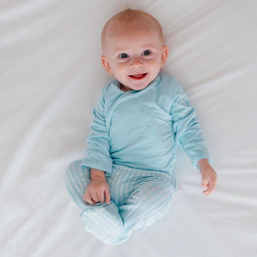 Cozy baby footie pants in silky modal fabric with an adorable Lil Surfer pattern.