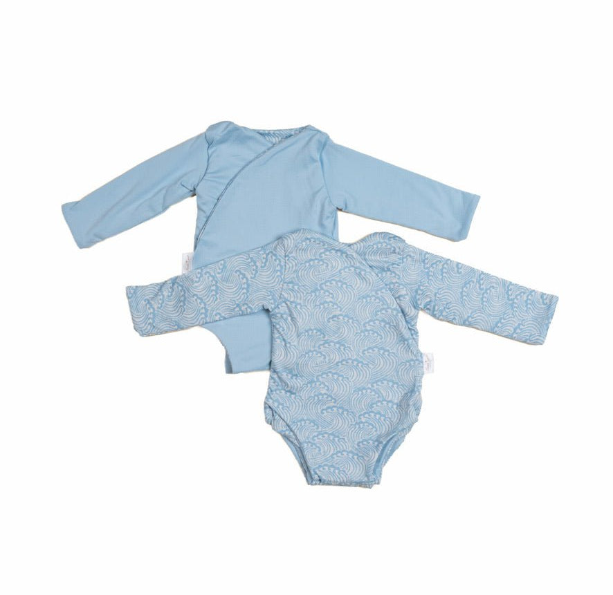 Reversible Blue Swells design long sleeve winged bodysuit.