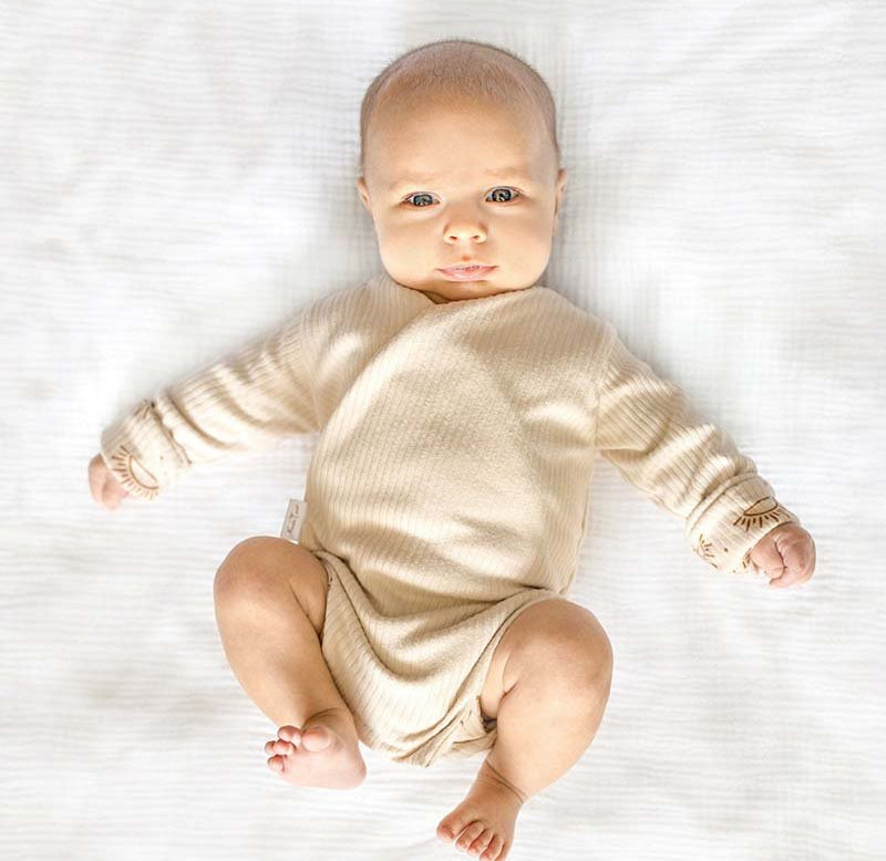 Reversible Sandy Sunsets design long sleeve winged bodysuit.