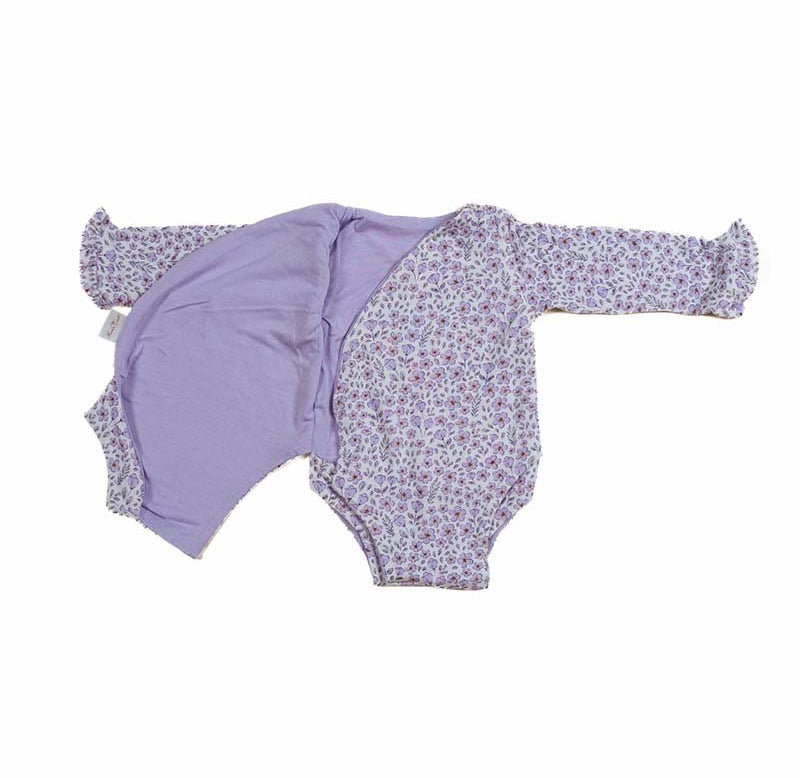 Reversible Purple Posies design ruffle cuff long sleeved winged bodysuit in silky modal fabric.
