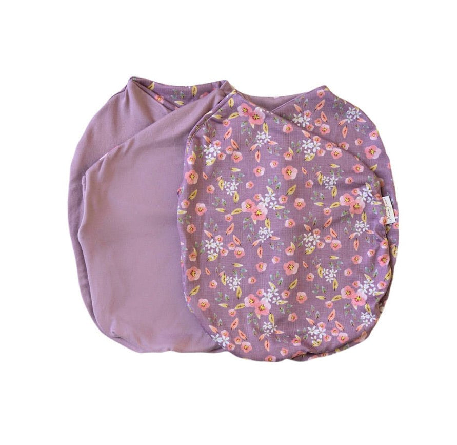 Reversible Peachy Lilac design baby cocoon swaddle.