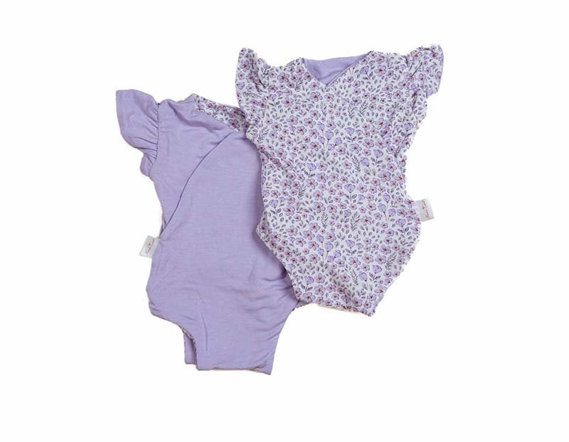 Reversible purple posies design flutter sleeve baby onesie in silky modal fabric.