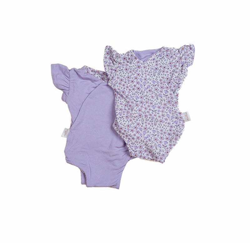 Reversible purple posies design flutter sleeve baby onesie in silky modal fabric.