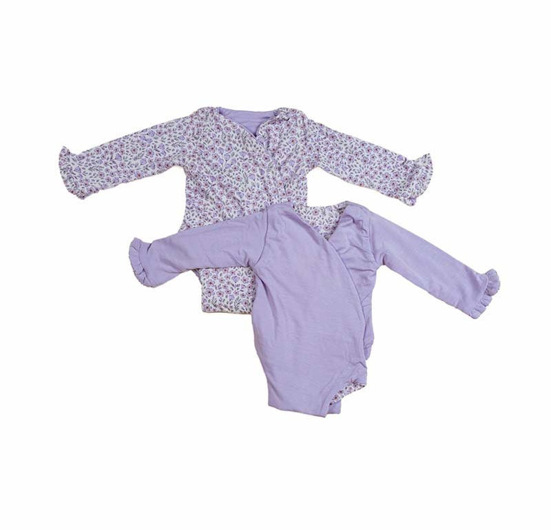 Reversible baby pink gingham design ruffle cuff long-sleeve winged bodysuit.