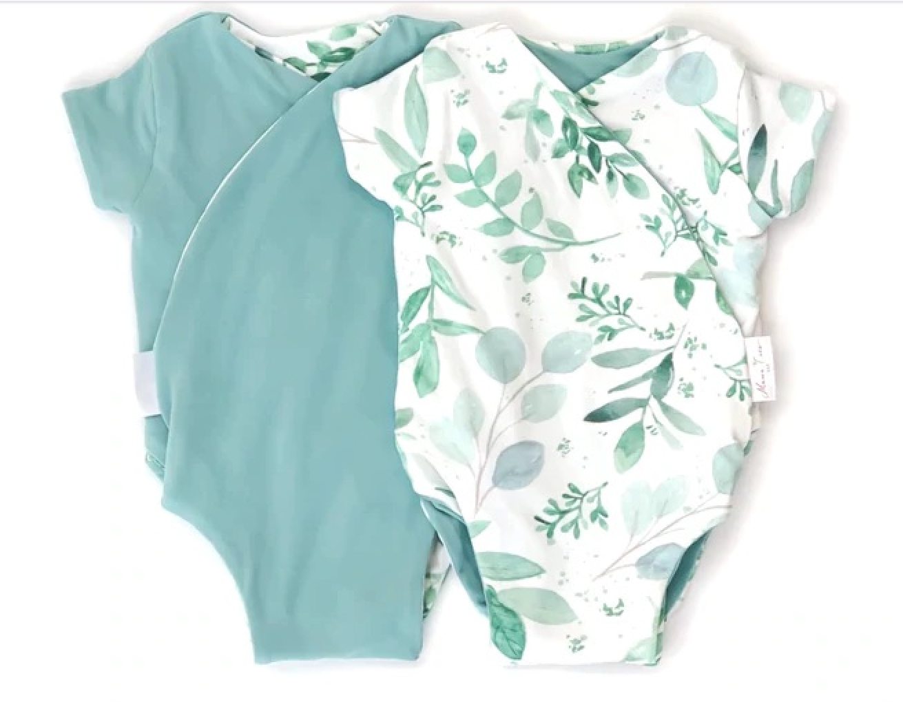 Reversible saged eucalyptus design short-sleeve baby onesie in classic brushed fabric.