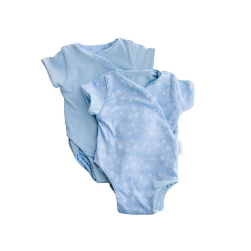 Reversible sailboat shores design short-sleeve baby onesie in classic brushed fabric.