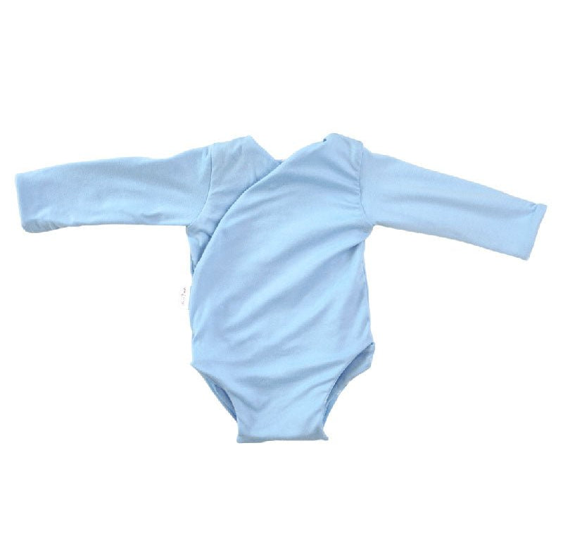 Reversible Sailboat Shores design long sleeved winged bodysuit in classic brushed fabric.
