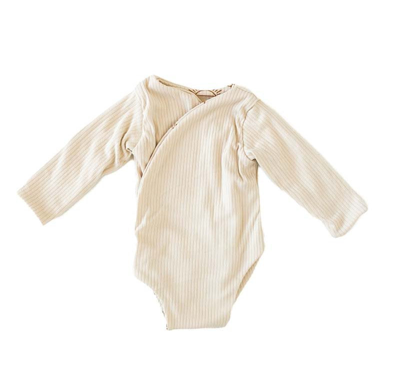 Reversible Sandy Sunsets design long sleeved winged bodysuit in classic brushed fabric.