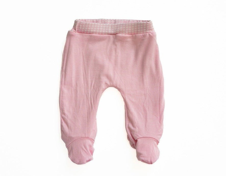 Reversible baby footie pants made with silky modal and finished in the Baby Pink Gingham design.