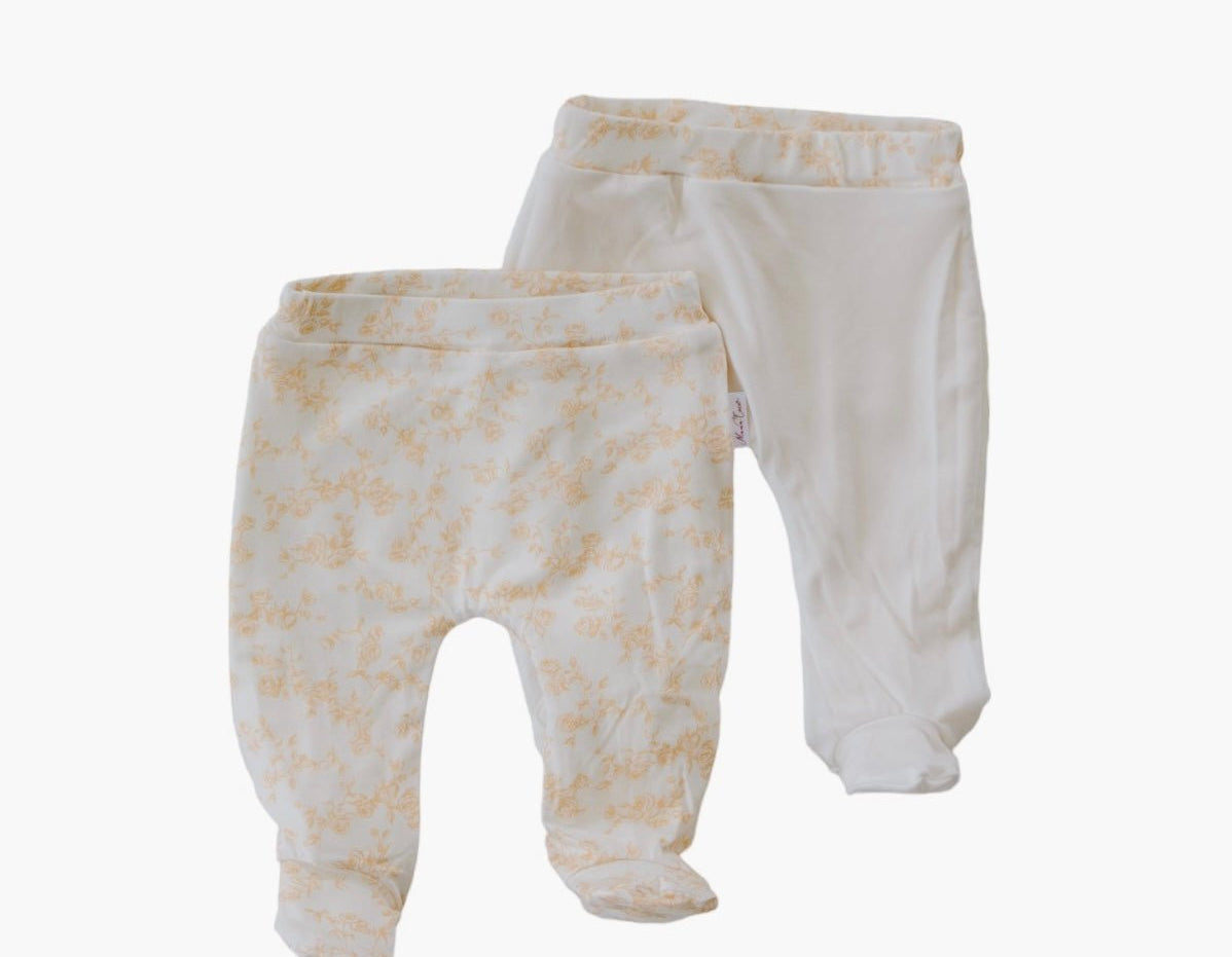 Reversible baby footie pants designed in silky modal fabric featuring our Bitty Blooms design.
