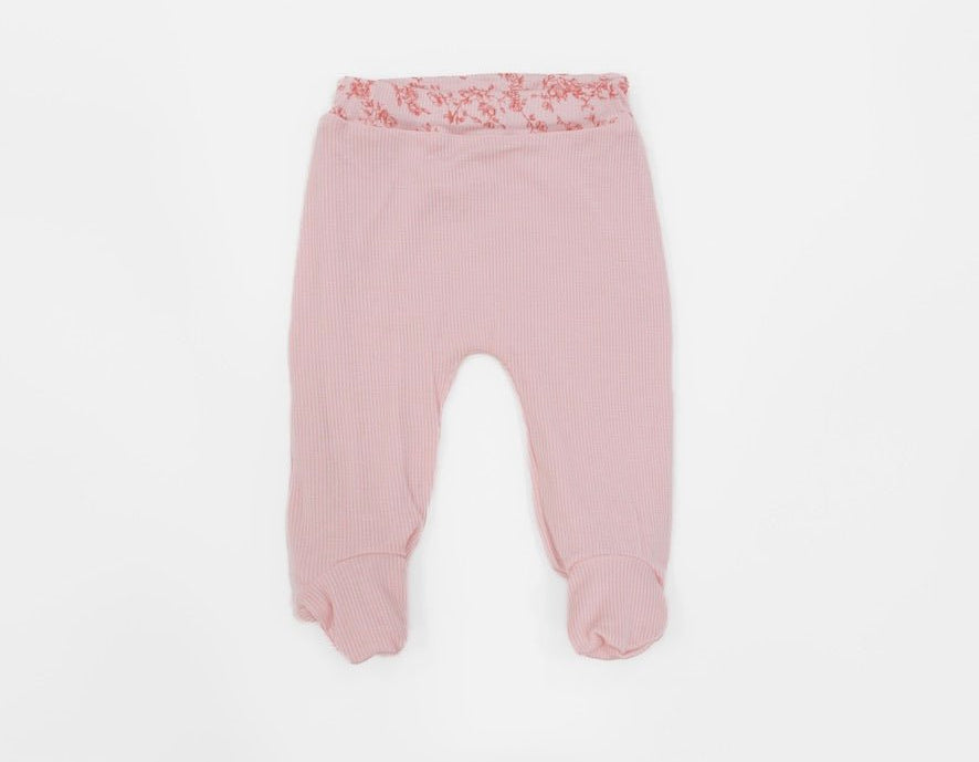Reversible baby footie pants designed in silky modal fabric featuring our Bitty Pink Blooms design.