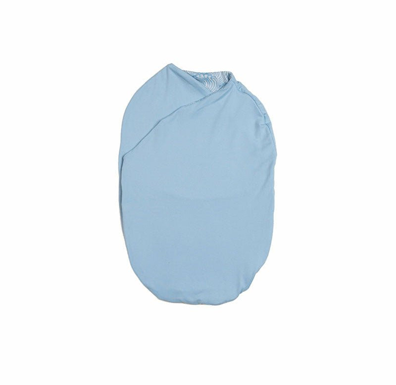 Cozy reversible Silky Modal Blue Swells baby cocoon swaddle for infants.
