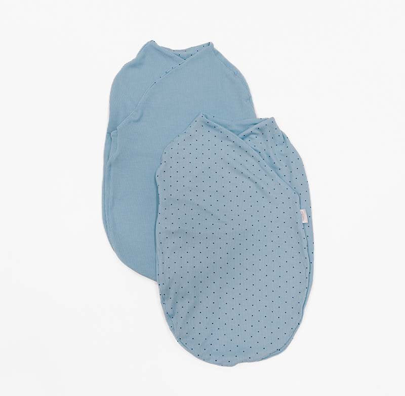 Reversible Soft Dotted Blues design on a Cocoon swaddle baby blanket in Silky Modal fabric styles.