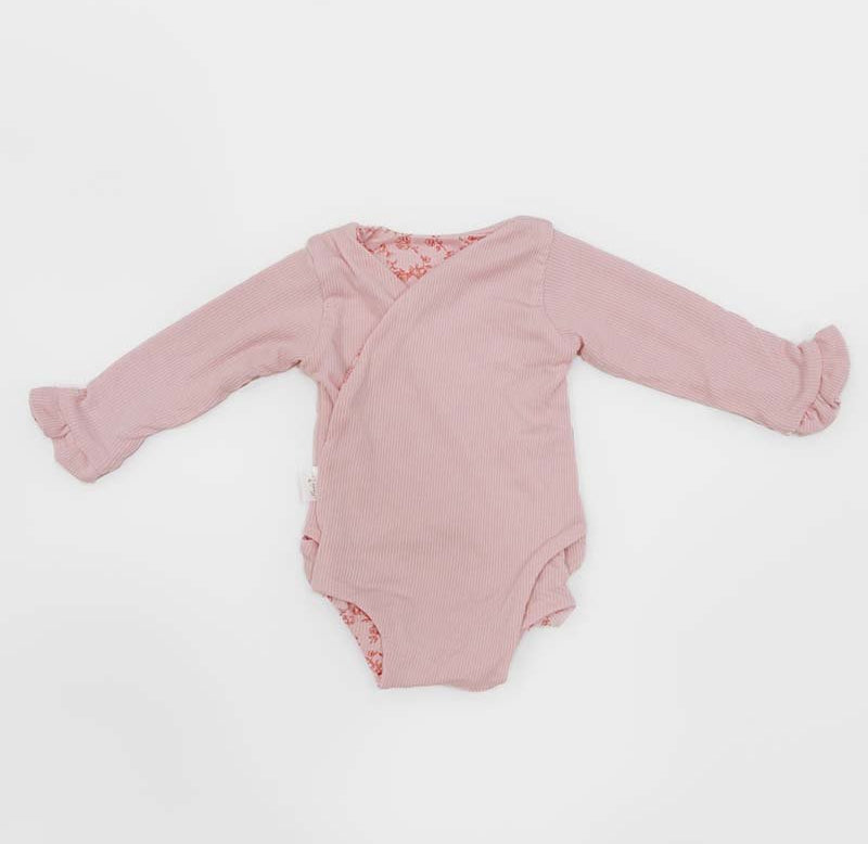 Reversible ruffle cuff baby winged bodysuit in Bitty Pink Blooms design.