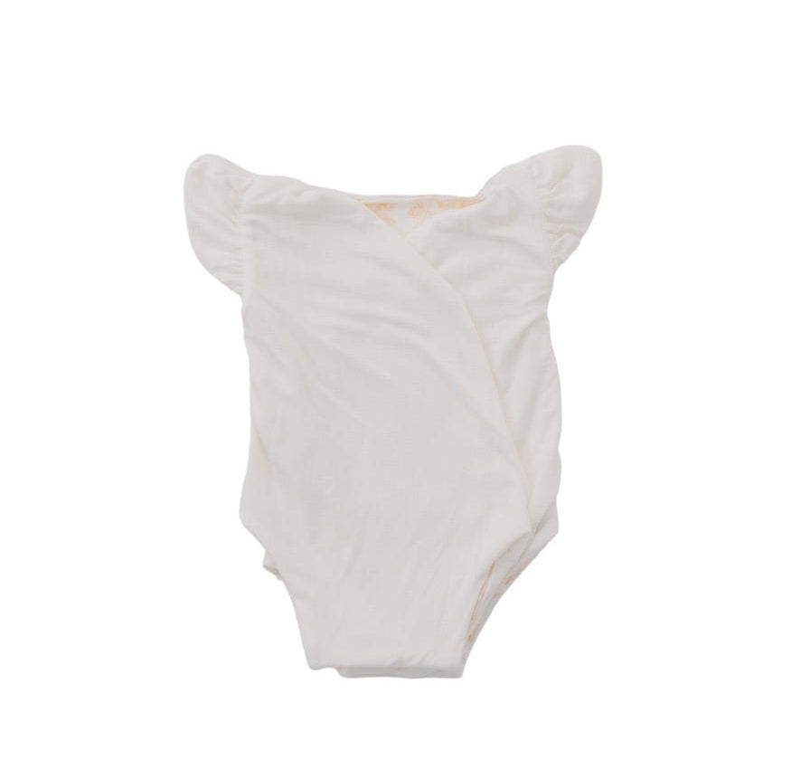 Reversible Bitty Blooms design flutter sleeve winged bodysuit for babies in silky modal fabric.