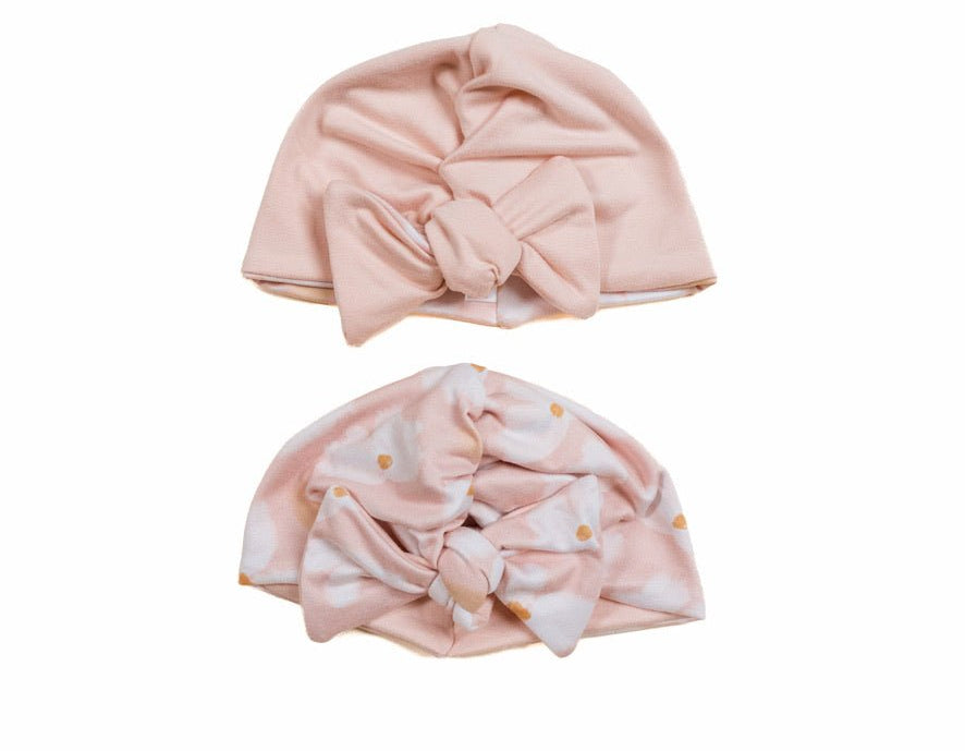 Reversible classic brushed baby beanie in sweet lily design.