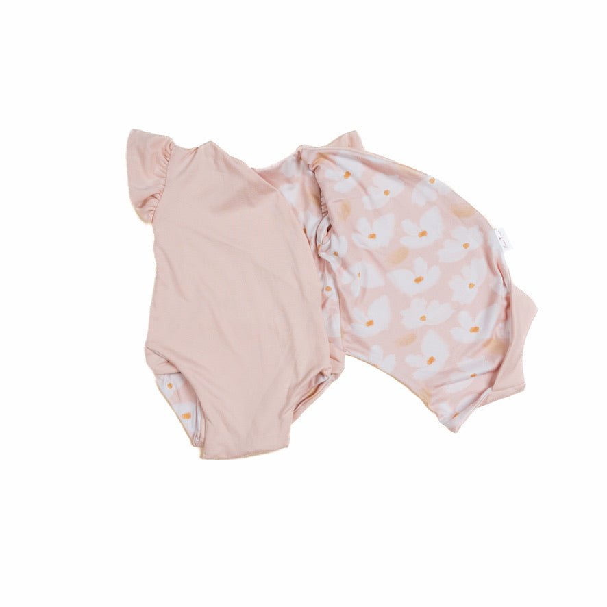 Reversible Sweet Lily floral short-sleeve bodysuit for baby in premium Classic Brushed fabric styles.