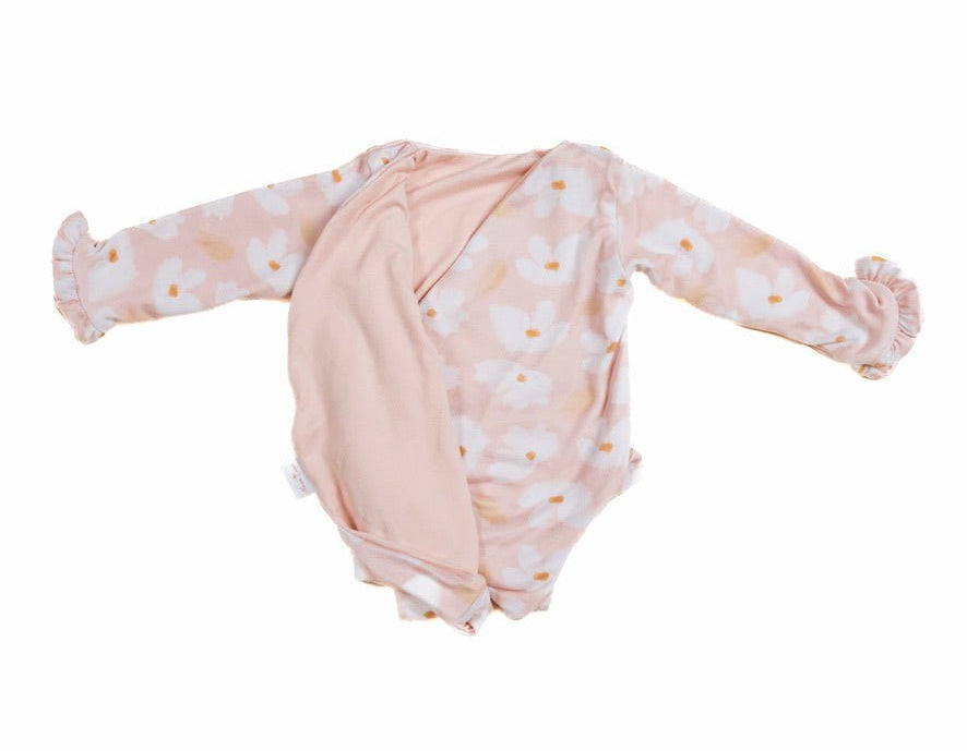 Reversible sweet lily long sleeve ruffle cuff baby onesie.