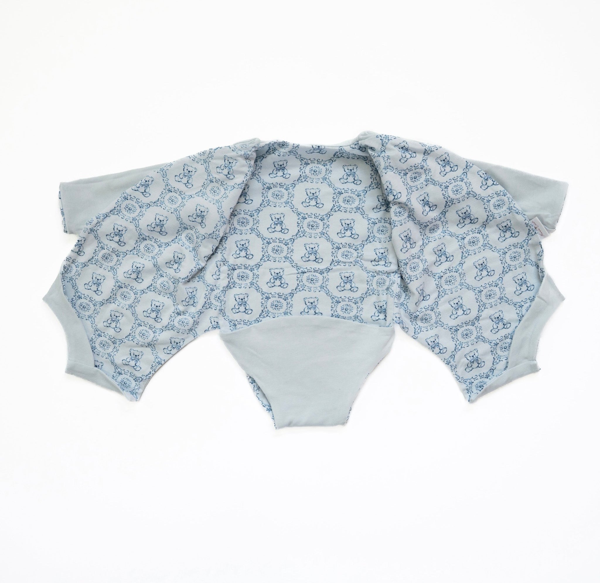 Reversible long-sleeve winged bodysuit for babies.