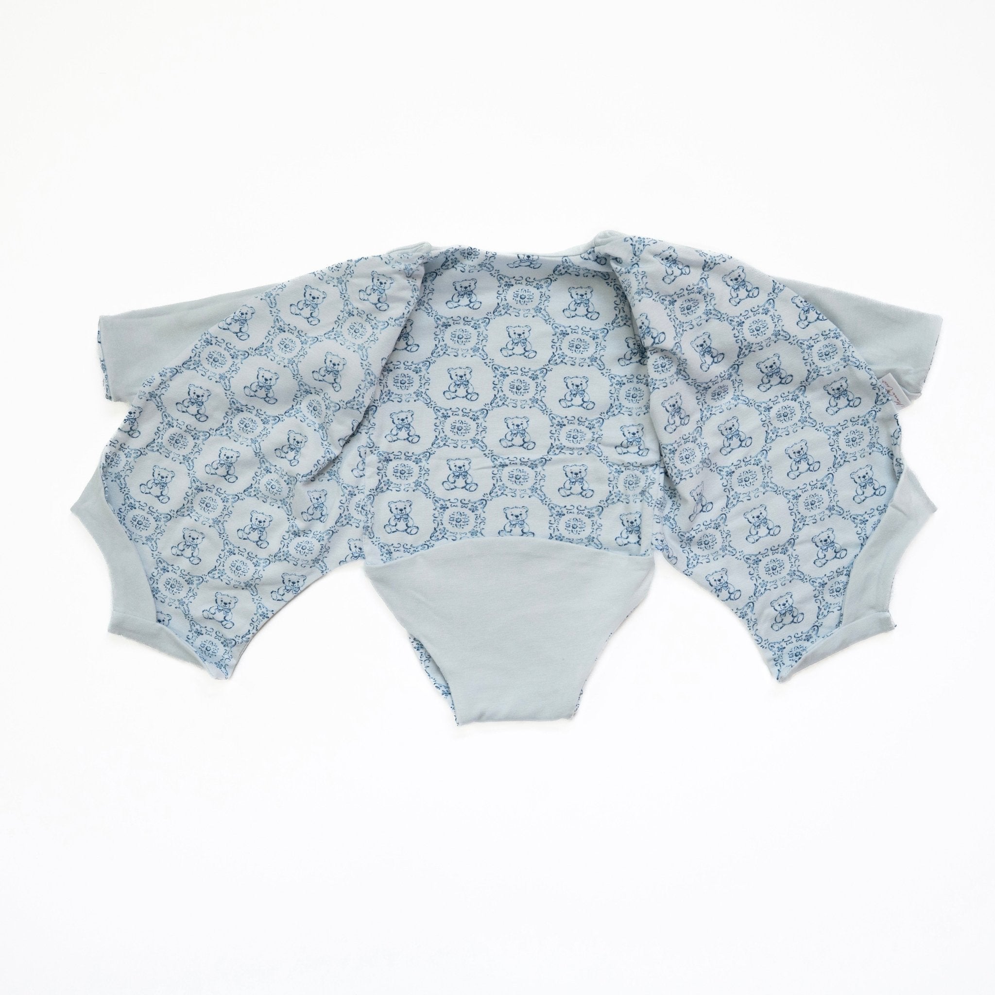 Reversible long-sleeve winged bodysuit for babies.