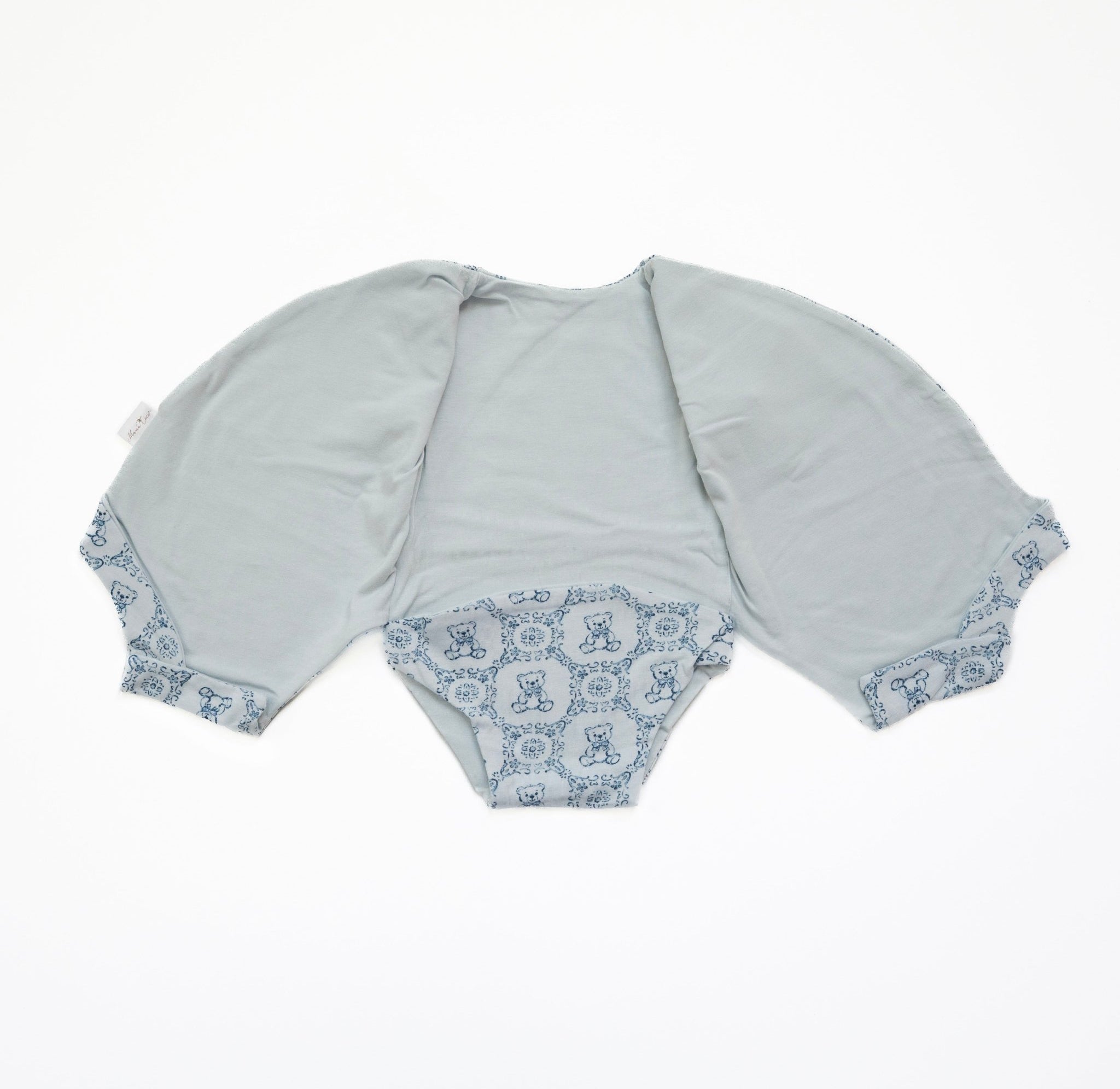 Reversible teddy tiles design short sleeve baby bodysuit in bamboo cotton fabric.