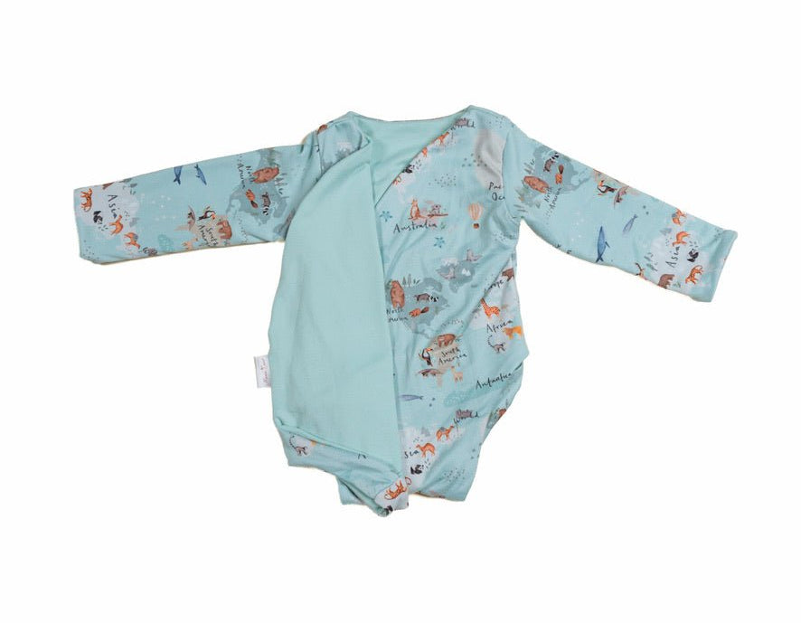 Reversible world traveler design long-sleeve baby onesie in classic brushed fabric.