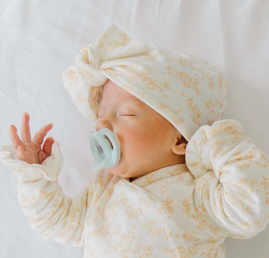 Ruched baby beanies with bows crafted in soft Bitty Blooms design Silky Modal fabric.