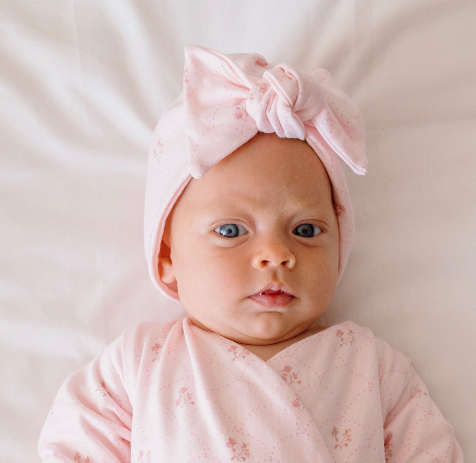Bamboo cotton baby beanie with ruched bow in dainty dots design.