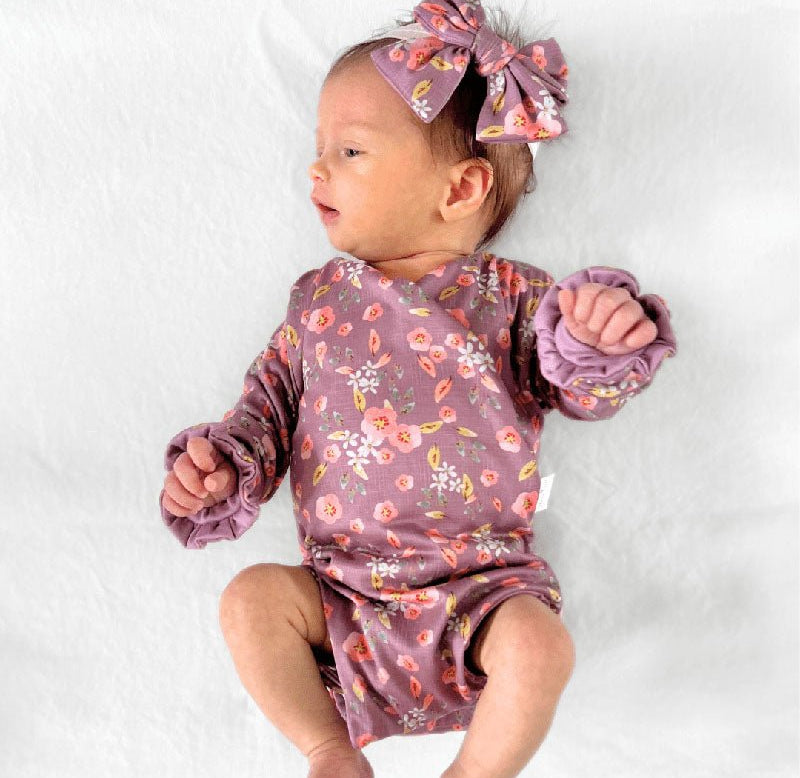 Ruffle cuff baby bodysuit with wings in Peachy Lilac design classic brushed fabric.