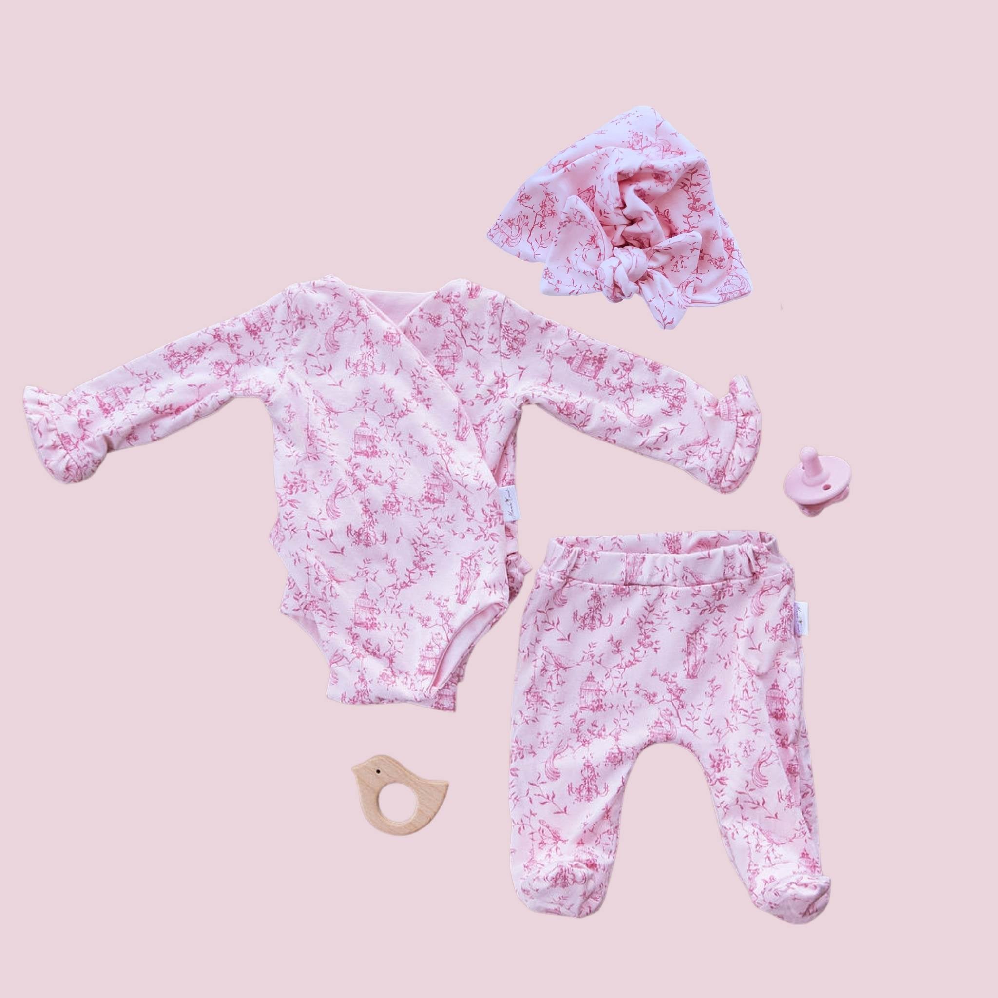 Long-sleeve ruffle cuff baby onesie outfit bundle made from bamboo cotton in whimsical garden design.