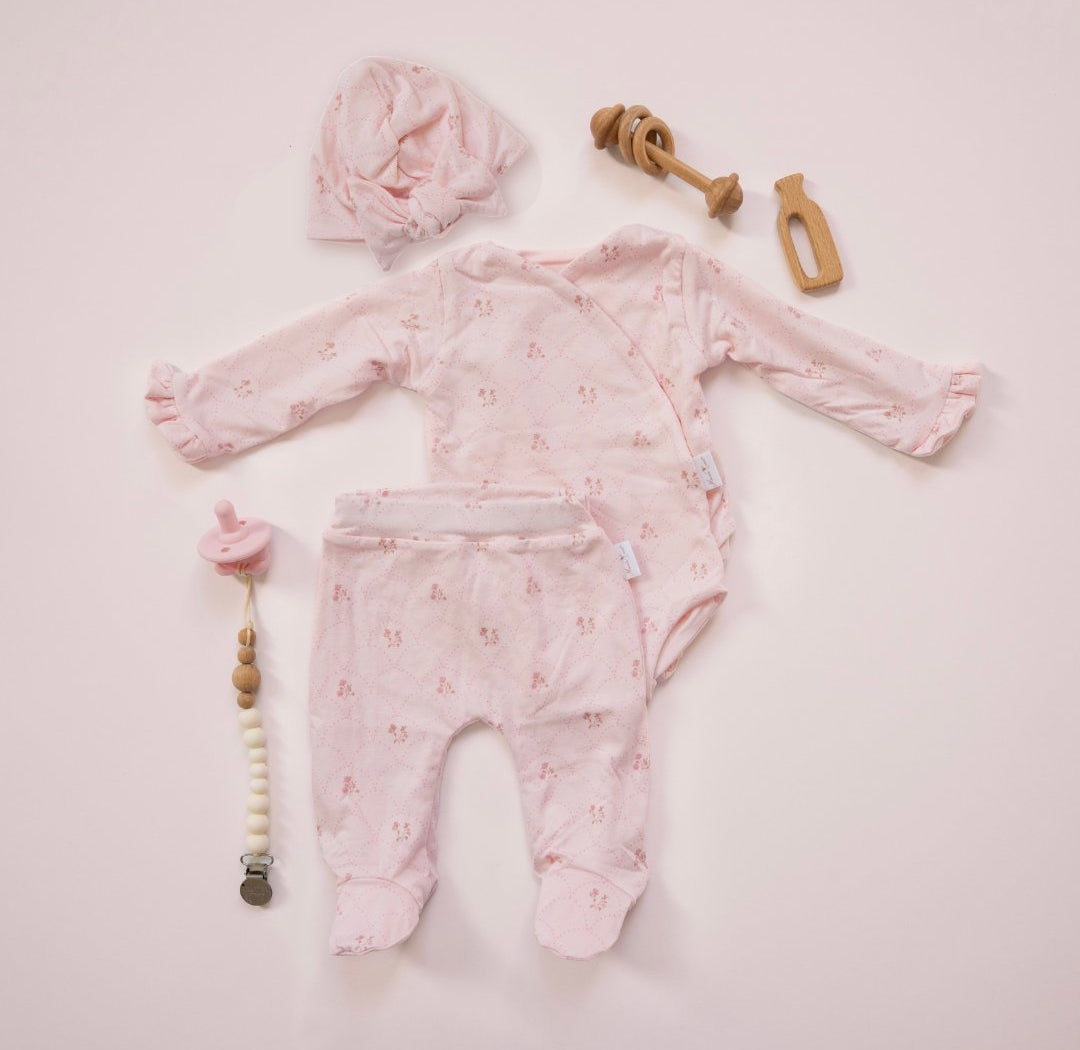 Long-sleeve ruffle cuff baby onesie outfit bundle made from bamboo cotton in dainty dots design.